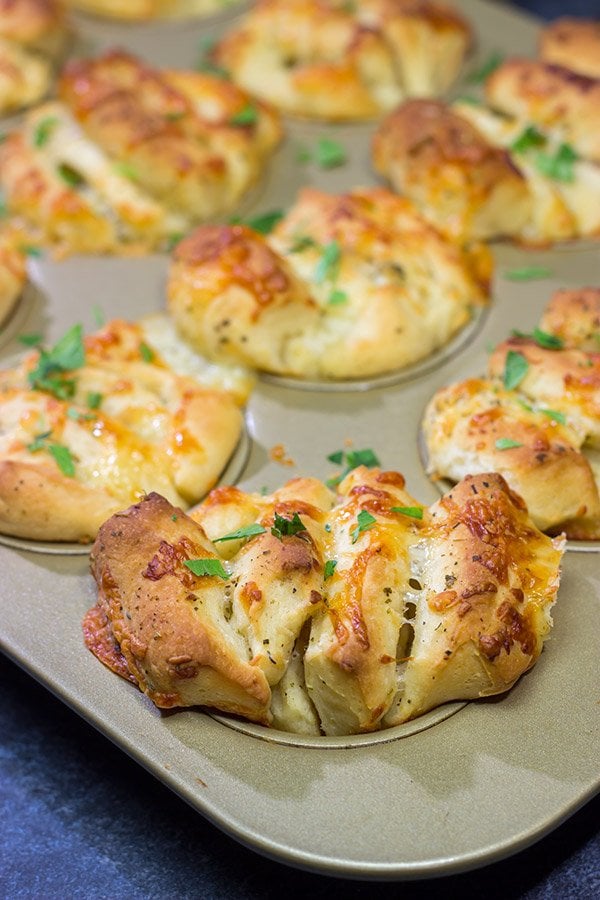 Half pull-apart roll, half garlic knot, these Cheesy Garlic Butterflake Rolls are a fun and delicious way to add flavor to the dinner table.  Bake up a batch today!
