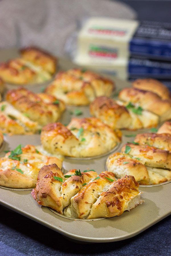 Half pull-apart roll, half garlic knot, these Cheesy Garlic Butterflake Rolls are a fun and delicious way to add flavor to the dinner table. Bake up a batch today!