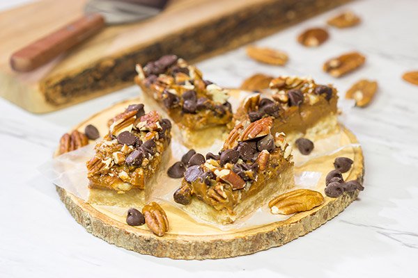 These Dulce de Leche Turtle Cookie Bars feature a shortbread cookie crust topped with dulce de leche, pecans and chocolate chips.  Yum!