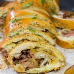 A good French Dip sandwich is hard to beat...unless you stuff it inside of garlic bread!  This French Dip Stuffed Garlic Bread is a comfort food favorite!