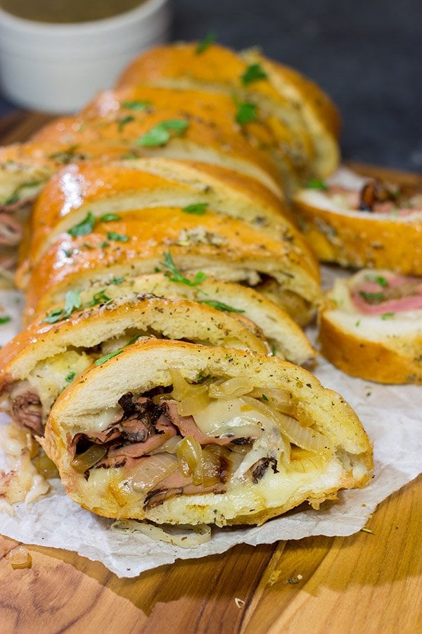 A good French Dip sandwich is hard to beat...unless you stuff it inside of garlic bread!  This French Dip Stuffed Garlic Bread is a comfort food favorite!