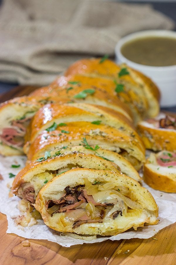 A good French Dip sandwich is hard to beat...unless you stuff it inside of garlic bread! This French Dip Stuffed Garlic Bread is a comfort food favorite!
