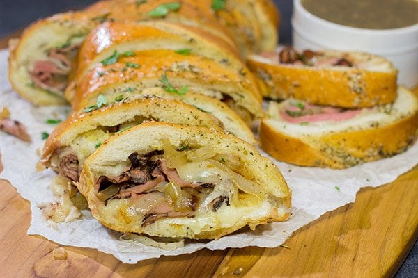 A good French Dip sandwich is hard to beat...unless you stuff it inside of garlic bread! This French Dip Stuffed Garlic Bread is a comfort food favorite!