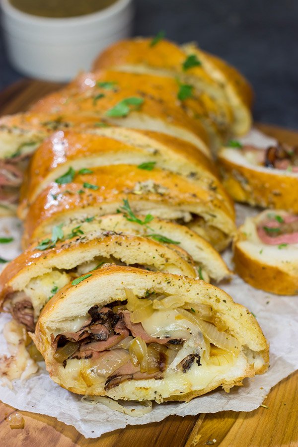 A good French Dip sandwich is hard to beat...unless you stuff it inside of garlic bread! This French Dip Stuffed Garlic Bread is a comfort food favorite!