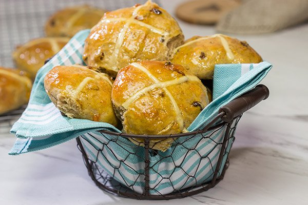 Heavily flavored with traditional baking spices, citrus zest and raisins, these Hot Cross Buns are a delicious way to start the morning!
