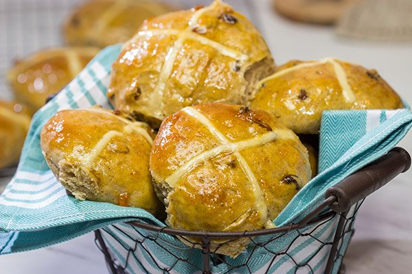 Heavily flavored with traditional baking spices, citrus zest and raisins, these Hot Cross Buns are a delicious way to start the morning!