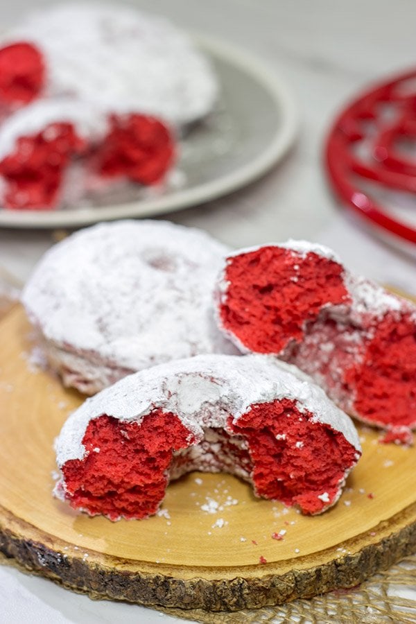 These Red Velvet Donuts are a fun way to put a festive spin on the classic baked powdered sugar donuts.  Bake up a batch for Valentine's Day!