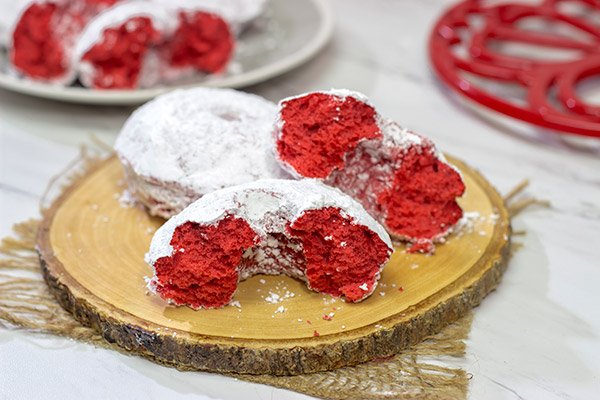 These Red Velvet Donuts are a fun way to put a festive spin on the classic baked powdered sugar donuts.  Bake up a batch for Valentine's Day!