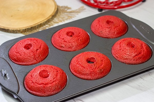These Red Velvet Donuts are a fun way to put a festive spin on the classic baked powdered sugar donuts.  Bake up a batch for Valentine's Day!