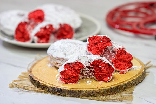 These Red Velvet Donuts are a fun way to put a festive spin on the classic baked powdered sugar donuts.  Bake up a batch for Valentine's Day!
