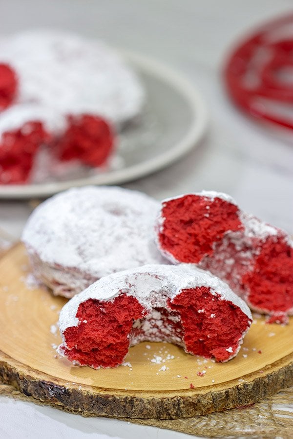 These Red Velvet Donuts are a fun way to put a festive spin on the classic baked powdered sugar donuts.  Bake up a batch for Valentine's Day!
