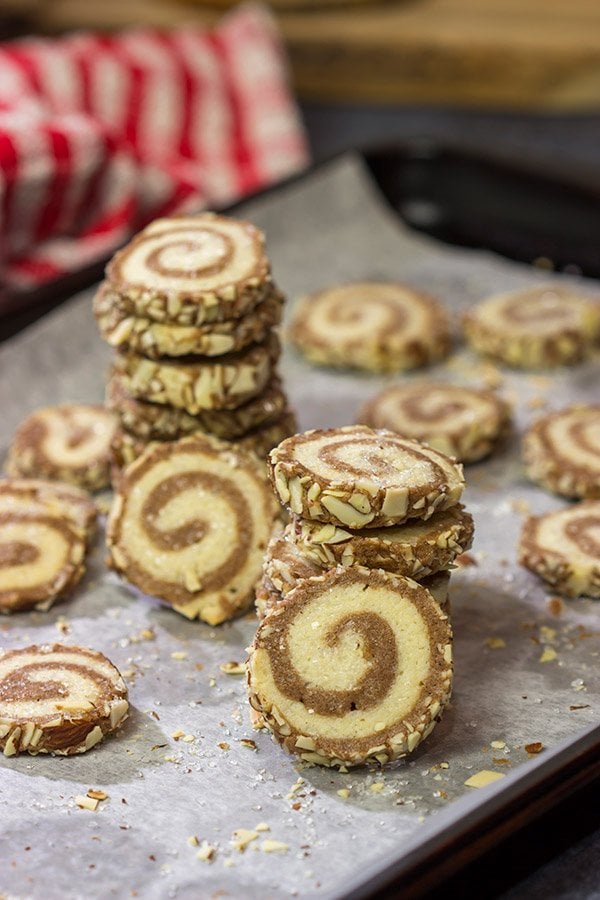 These Chocolate Almond Sugar Cookies have something for everyone! These swirled chocolate and vanilla cookies get rolled in chopped almonds before going into the oven. Yum!