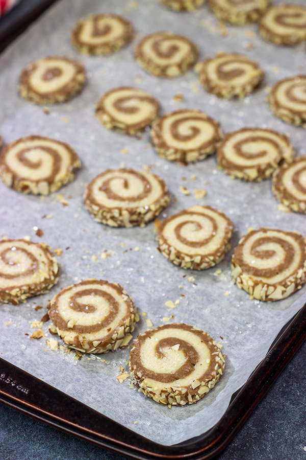 These Chocolate Almond Sugar Cookies have something for everyone!  These swirled chocolate and vanilla cookies get rolled in chopped almonds before going into the oven.  Yum!