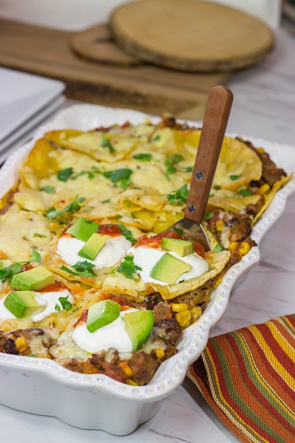 Looking for a fun way to mix up the dinner routine? This Mexican Lasagna features beef chorizo layered between corn tortillas, refried beans and plenty of melted cheese!