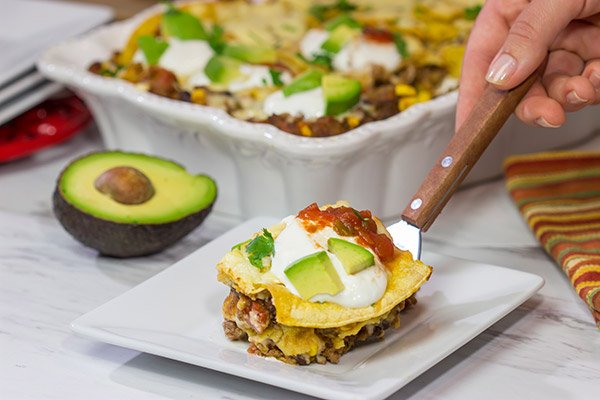 Looking for a fun way to mix up the dinner routine? This Mexican Lasagna features beef chorizo layered between corn tortillas, refried beans and plenty of melted cheese!