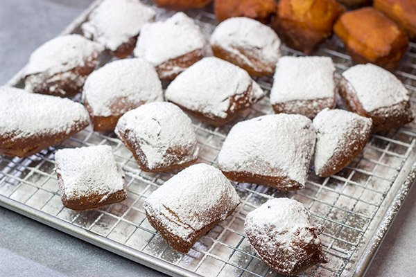 New Orleans Beignets are a classic sweet treat in the Crescent City. Now you can make a batch at home...complete with plenty of powdered sugar!