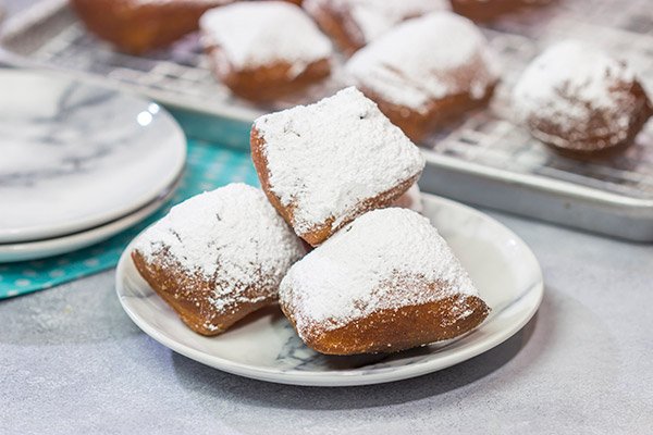 New Orleans Beignets are a classic sweet treat in the Crescent City. Now you can make a batch at home...complete with plenty of powdered sugar!