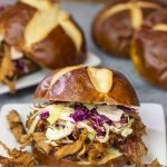 Looking for a fun way to serve pulled pork?  Grab (or make) pretzel rolls and serve up this Pulled Pork on a Pretzel Roll!