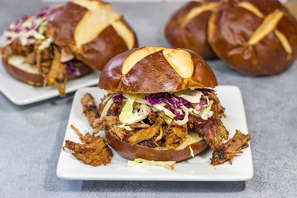 Looking for a fun way to serve pulled pork?  Grab (or make) pretzel rolls and serve up this Pulled Pork on a Pretzel Roll!