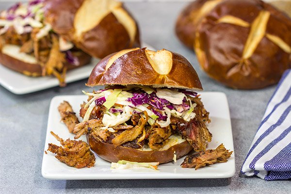 Looking for a fun way to serve pulled pork?  Grab (or make) pretzel rolls and serve up this Pulled Pork on a Pretzel Roll!