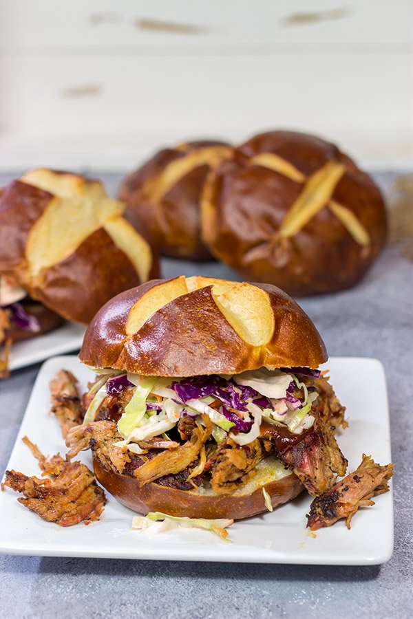 Looking for a fun way to serve pulled pork?  Grab (or make) pretzel rolls and serve up this Pulled Pork on a Pretzel Roll!