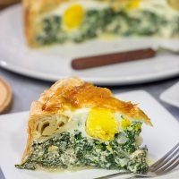 Torta Pasqualina is a traditional Italian recipe served at Easter. This delicious pie features a puff pastry crust stuffed with spinach, ricotta and eggs - yum!
