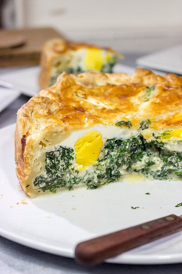 Torta Pasqualina is a traditional Italian recipe served at Easter. This delicious pie features a puff pastry crust stuffed with spinach, ricotta and eggs - yum!