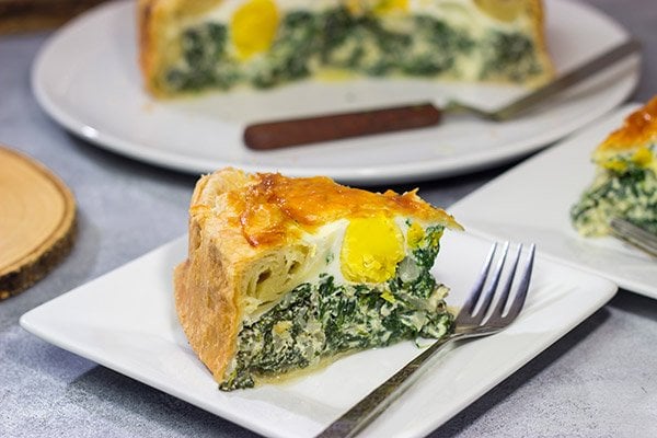 Torta Pasqualina is a traditional Italian recipe served at Easter. This delicious pie features a puff pastry crust stuffed with spinach, ricotta and eggs - yum!