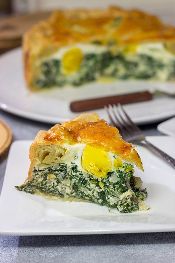 Torta Pasqualina is a traditional Italian recipe served at Easter. This delicious pie features a puff pastry crust stuffed with spinach, ricotta and eggs - yum!