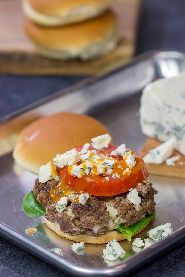 Looking for a fun spin on a classic summer meal?  Grab some blue cheese and buffalo sauce and grill up a batch of these Buffalo Blue Cheese Burgers!