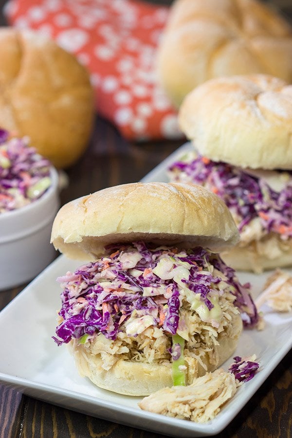 Topped with crunchy coleslaw, these Carolina Style BBQ Shredded Chicken Sandwiches make for a tasty meal!