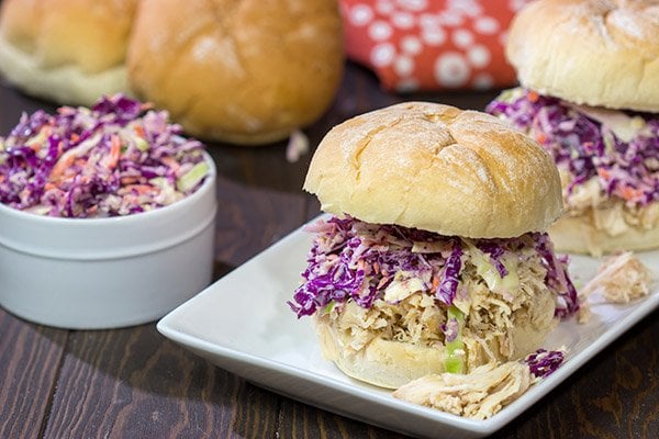 Topped with crunchy coleslaw, these Carolina Style BBQ Shredded Chicken Sandwiches make for a tasty meal!