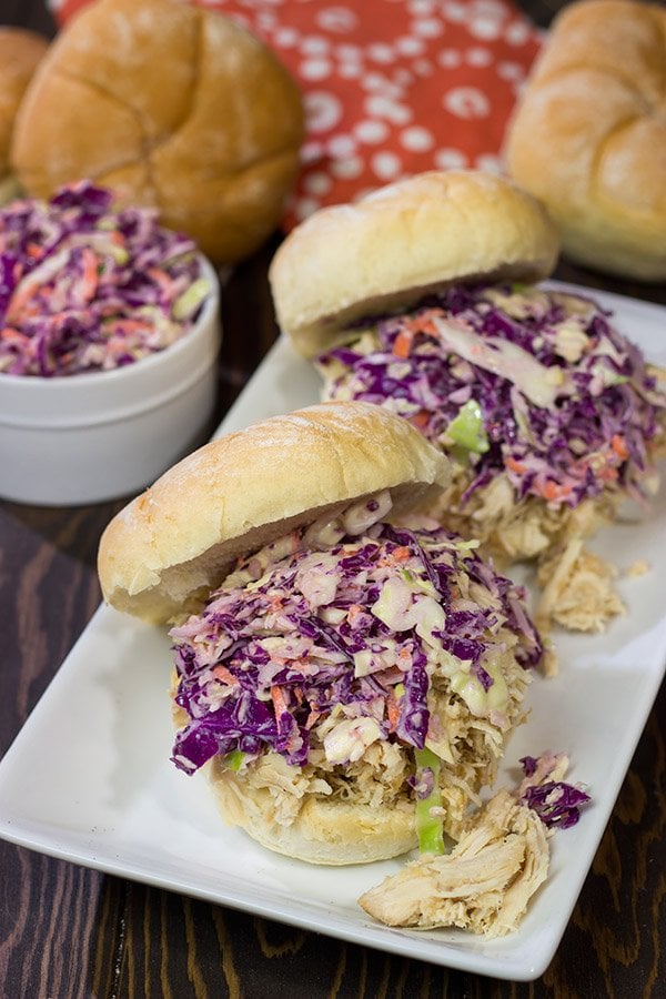 Topped with crunchy coleslaw, these Carolina Style BBQ Shredded Chicken Sandwiches make for a tasty meal!