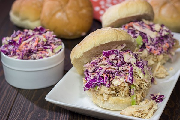Topped with crunchy coleslaw, these Carolina Style BBQ Shredded Chicken Sandwiches make for a tasty meal!