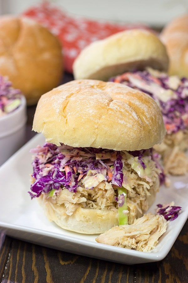 Topped with crunchy coleslaw, these Carolina Style BBQ Shredded Chicken Sandwiches make for a tasty meal!
