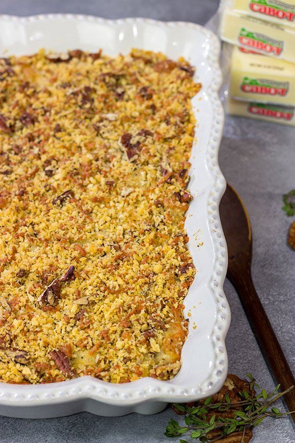 Topped with crunchy pecans, this Cheesy Butternut Squash Casserole is a delicious Autumn side dish.  It's now a staple in our house!
