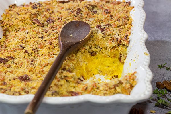Topped with crunchy pecans, this Cheesy Butternut Squash Casserole is a delicious Autumn side dish.  It's now a staple in our house!