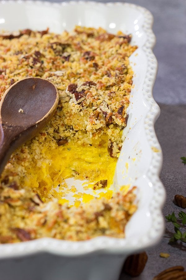Topped with crunchy pecans, this Cheesy Butternut Squash Casserole is a delicious Autumn side dish.  It's now a staple in our house!