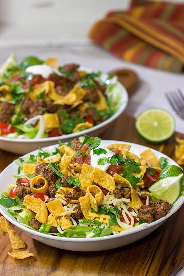This Ground Beef Taco Salad is easy and delicious! This classic recipe is ready in just 15 minutes...just don't eat all of the Fritos first!