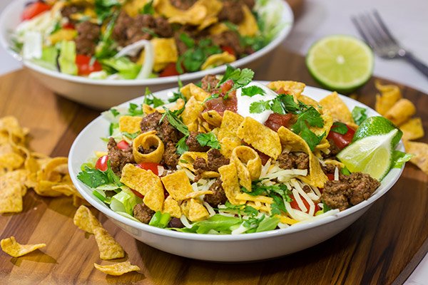 This Ground Beef Taco Salad is easy and delicious! This classic recipe is ready in just 15 minutes...just don't eat all of the Fritos first!