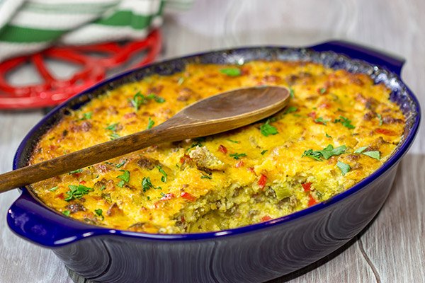 Give grits a chance! Loaded with all sorts of yummy ingredients, this Sausage and Cheese Grits Casserole is a great way to enjoy a lazy brunch or perhaps breakfast for dinner!