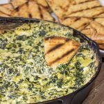 Looking for a fun appetizer recipe with an outdoor smoky twist?  Fire up the grill or smoker and make a batch of this Smoked Spinach Artichoke Dip!