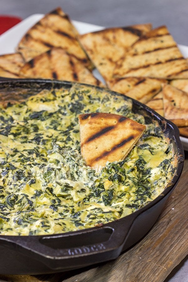 Looking for a fun appetizer recipe with an outdoor smoky twist? Fire up the grill or smoker and make a batch of this Smoked Spinach Artichoke Dip!