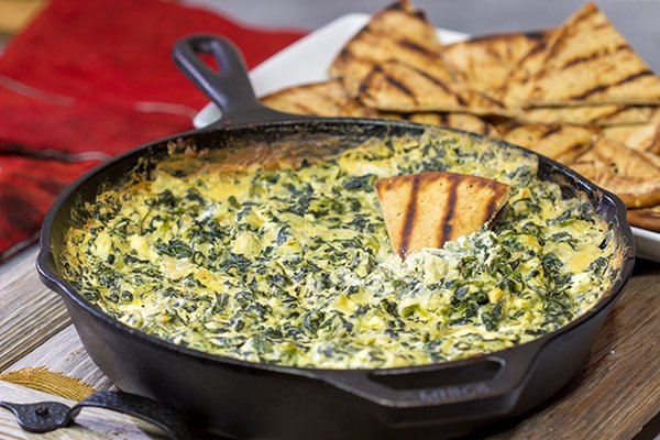 Looking for a fun appetizer recipe with an outdoor smoky twist? Fire up the grill or smoker and make a batch of this Smoked Spinach Artichoke Dip!