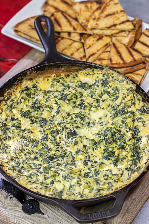 Looking for a fun appetizer recipe with an outdoor smoky twist? Fire up the grill or smoker and make a batch of this Smoked Spinach Artichoke Dip!