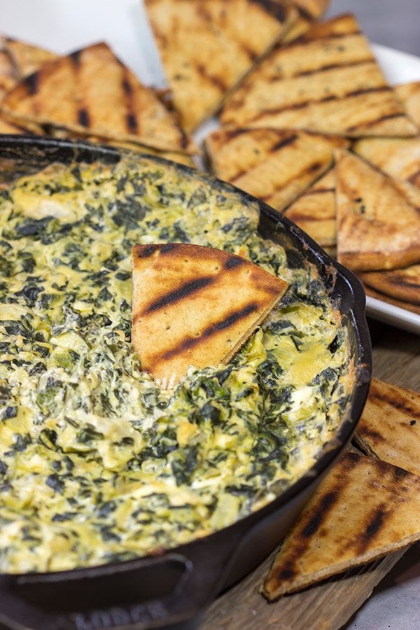 Looking for a fun appetizer recipe with an outdoor smoky twist? Fire up the grill or smoker and make a batch of this Smoked Spinach Artichoke Dip!