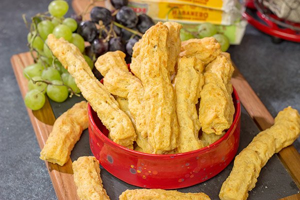 Looking for a tasty party appetizer?  Or a snack for movie night in the basement?  Put a batch of these Southern Cheese Straws on the menu!