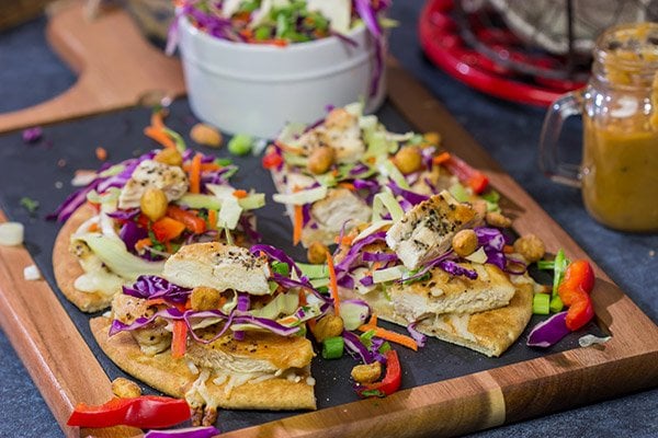 These Thai Chicken Flatbreads are a fun and colorful appetizer or main course! They get topped with a tasty peanut sauce for extra flavor.