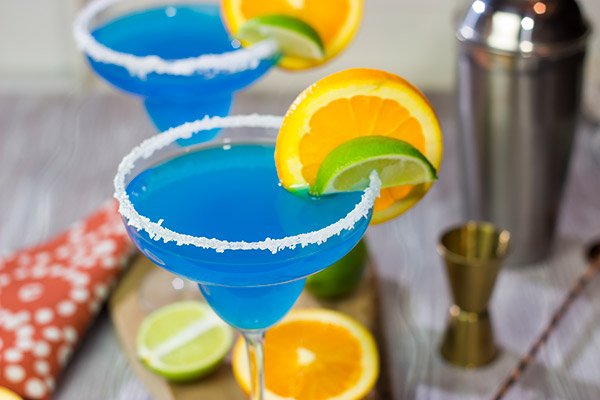Looking for a fun twist on a classic cocktail? Pull out a bottle of blue curacao and whip up this Blue Margarita!