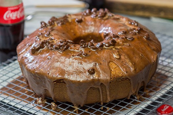Topped with a chocolate glaze, this Coca Cola Pound Cake is a unique dessert idea! Grab a slice today!